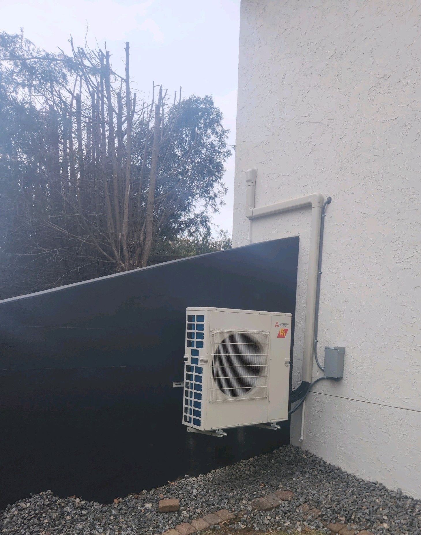 A picture of a heating system in a basement.