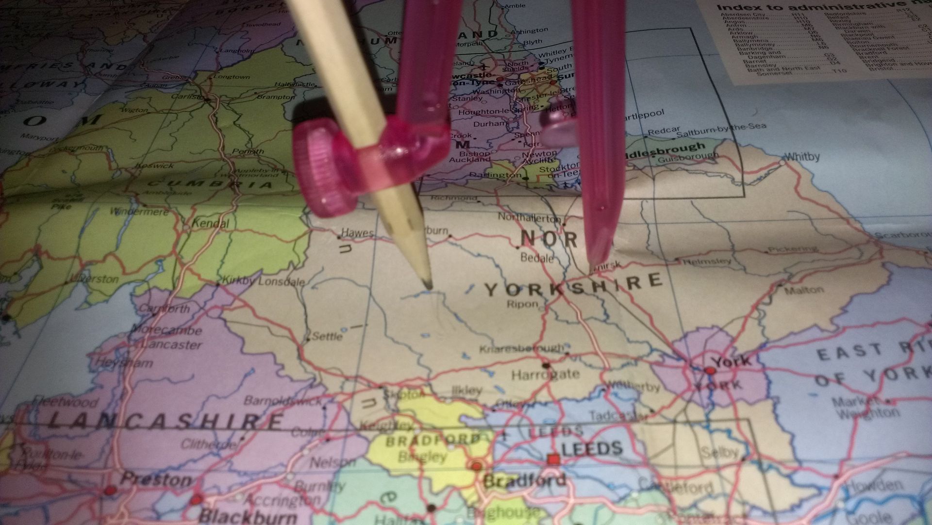 map and pair of compasses