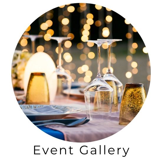 Event gallery icon showing an elegant table with wine glasses and warm bokeh lights