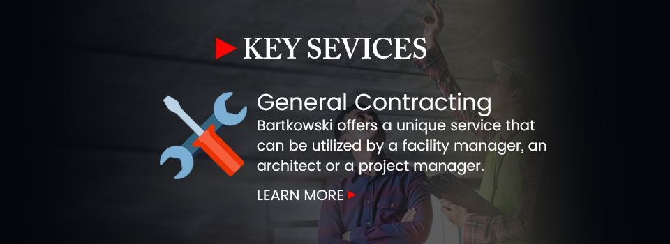 A sign that says key services general contracting on it