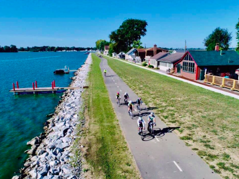 Trail cyclists and runners by the water in Buckeye Lake