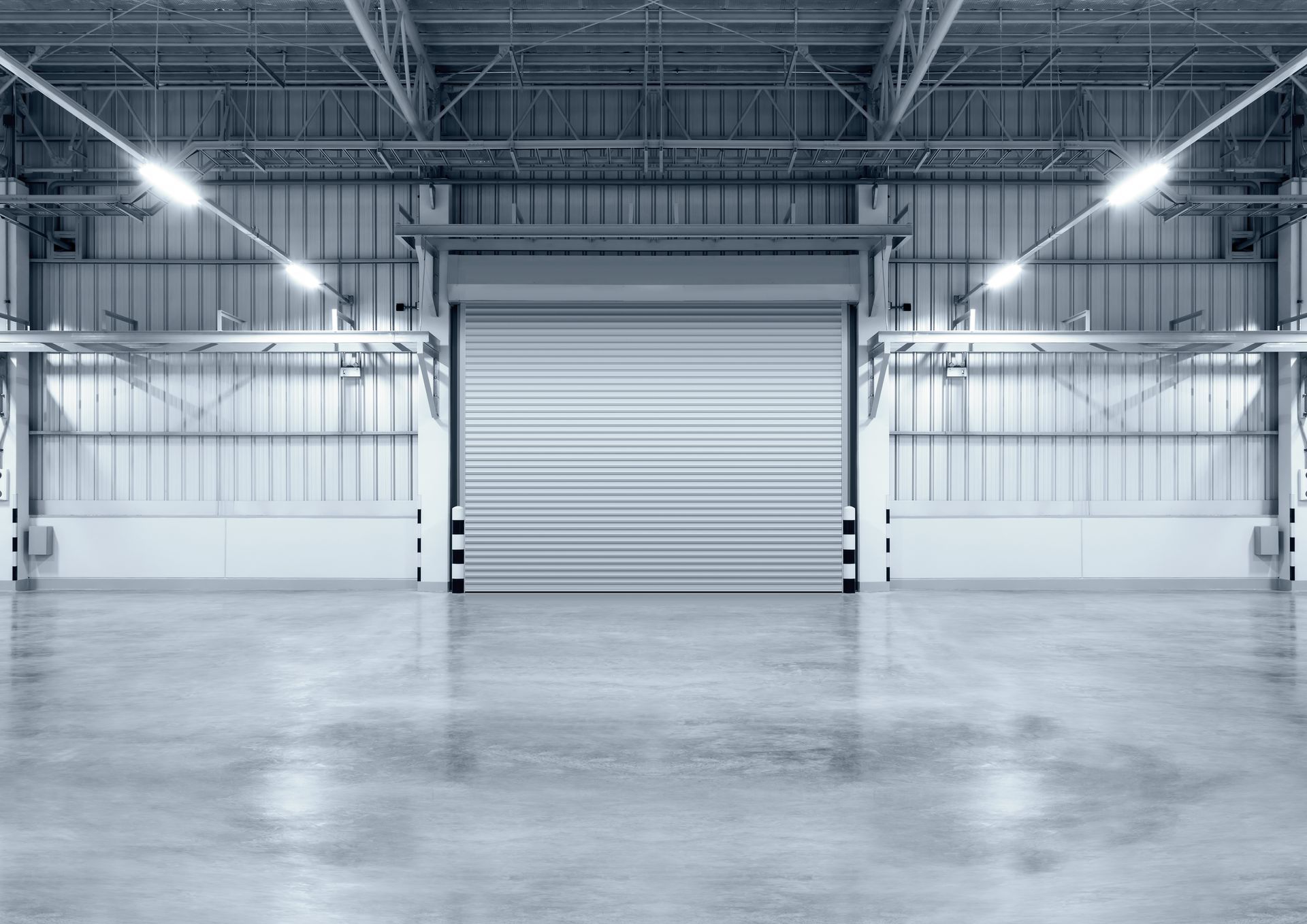 Factory roller door, modern interior, polished concrete, spacious display zone.