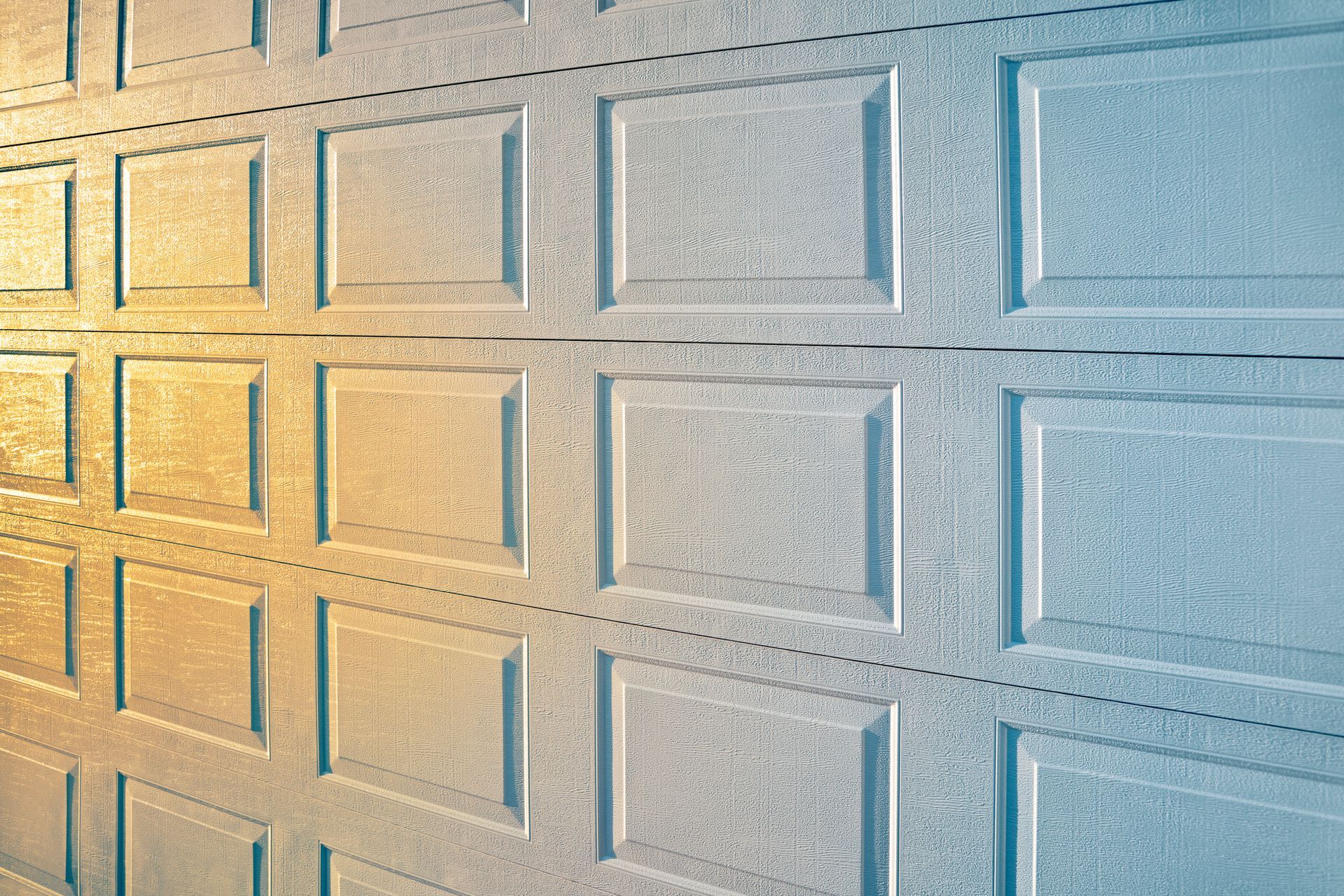 A close up of a garage door with squares on it.