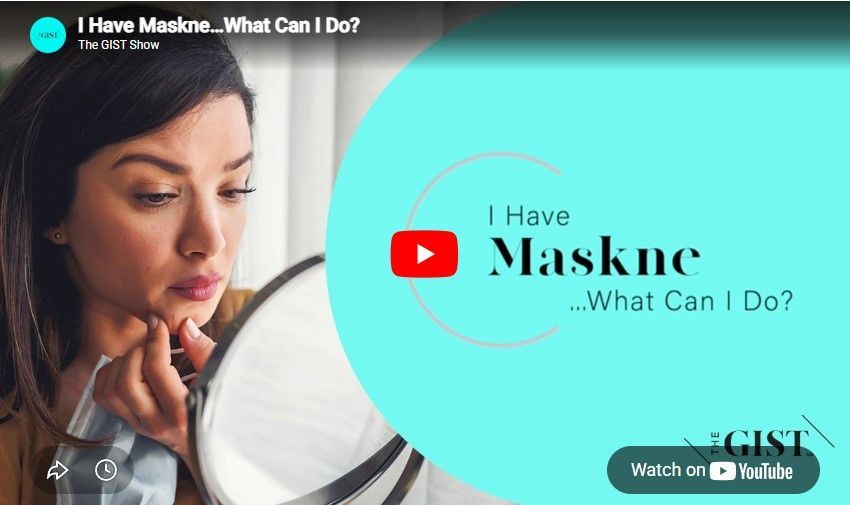 A person looks in a mirror while holding a mask. Text reads: 