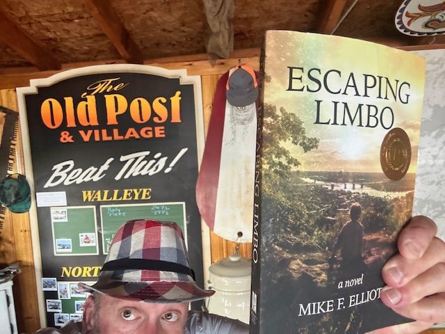 Person holding a book titled 
