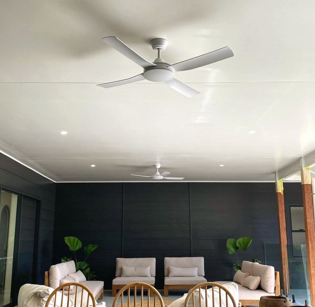 A Ceiling Fan Installed In An Outdoor Setting Above Outdoor Furniture Set — Brightway Lighting in Lismore, NSW