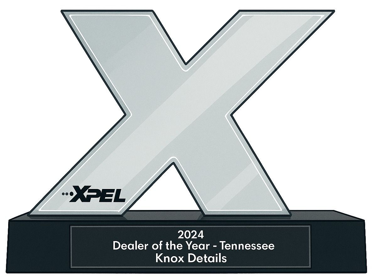 Trophy with large silver XPEl logo and plaque reading “2024 Dealer of the Year - Tennessee Knox Details”