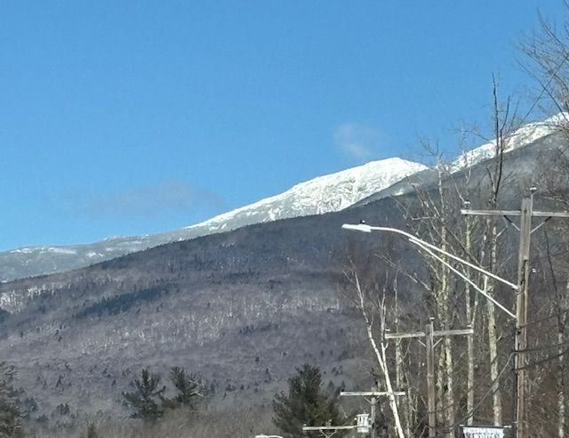 Snow-capped mountain with blue sky