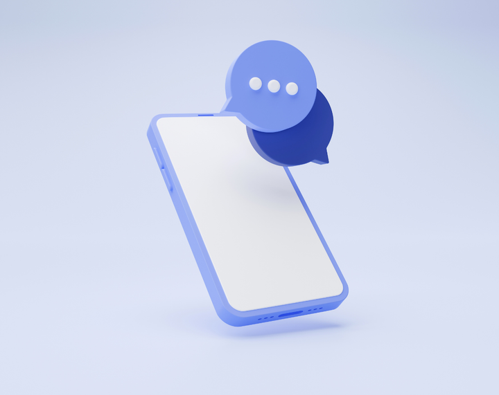 A cell phone with a speech bubble coming out of it.