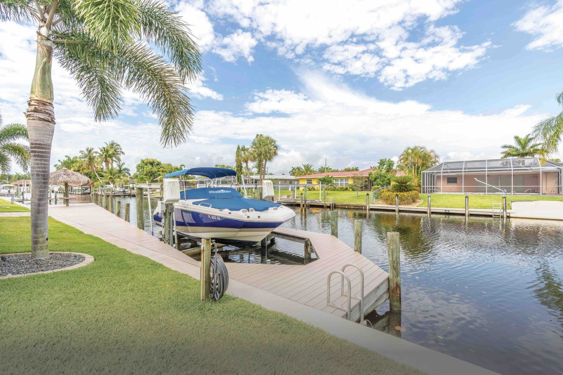 A boat is docked at Congo Breeze vacation rental in Cape Coral, Florida.