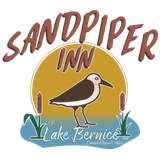A logo for sandpiper inn lake bernice with a bird