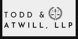 Todd & Atwill, LLP law firm logo with scales icon
