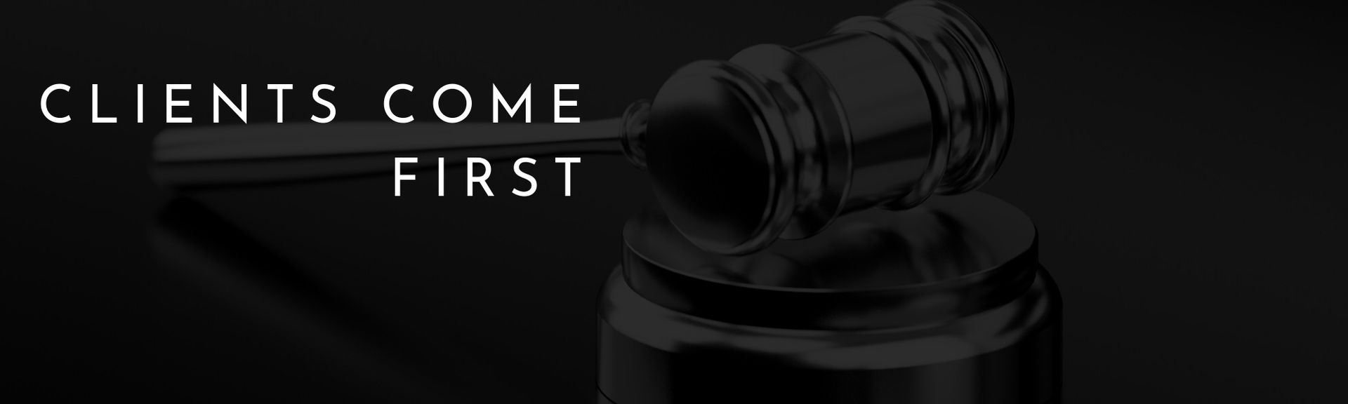 Gavel on black background with the words “Clients come first” in white text