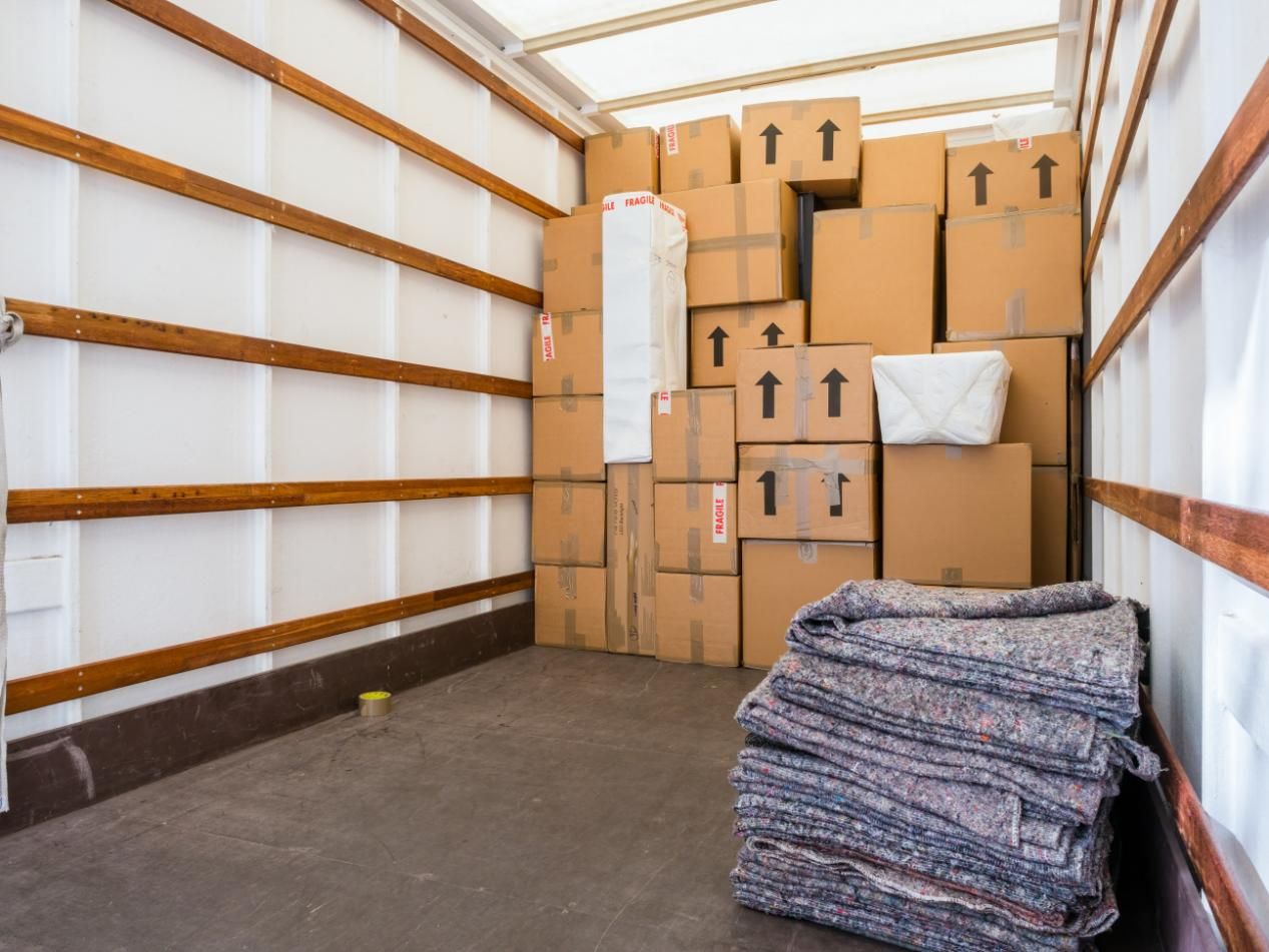 The Inside of A Moving Truck Filled with Boxes and Blankets — Dunford Removals in Bargara, QLD