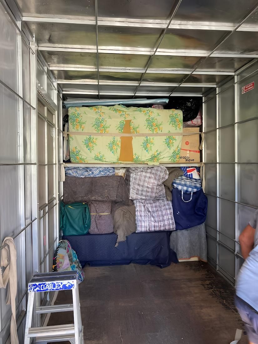 The Inside of a Truck Filled With Lots of Mattresses and Bags — Dunford Removals in Gin Gin, QLD