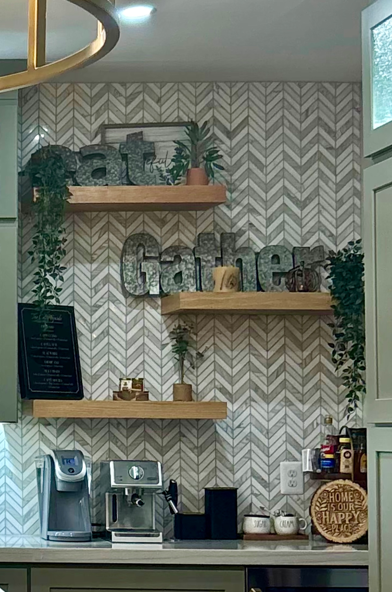 Wall-mounted shelves with coffee decor and appliances in a chevron-patterned café corner