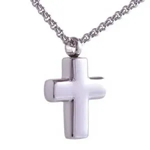 A silver cross necklace on a chain on a white background.