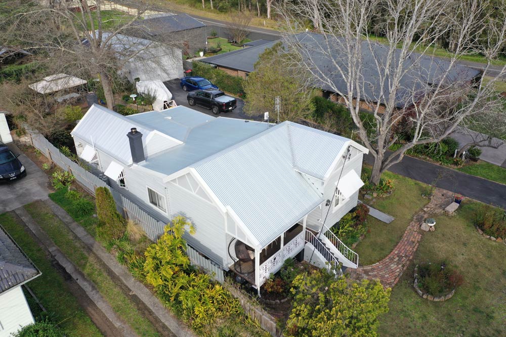 Home With White Roof — Roofing And Guttering In Newcastle, NSW