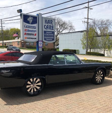 Black convertible car parked in front of Libertyville Kar Care