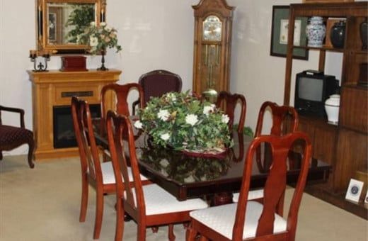 Several Photos of different caskets, gravestones, hearses, interior and exterior views of Kincannon Funeral Home in OK.