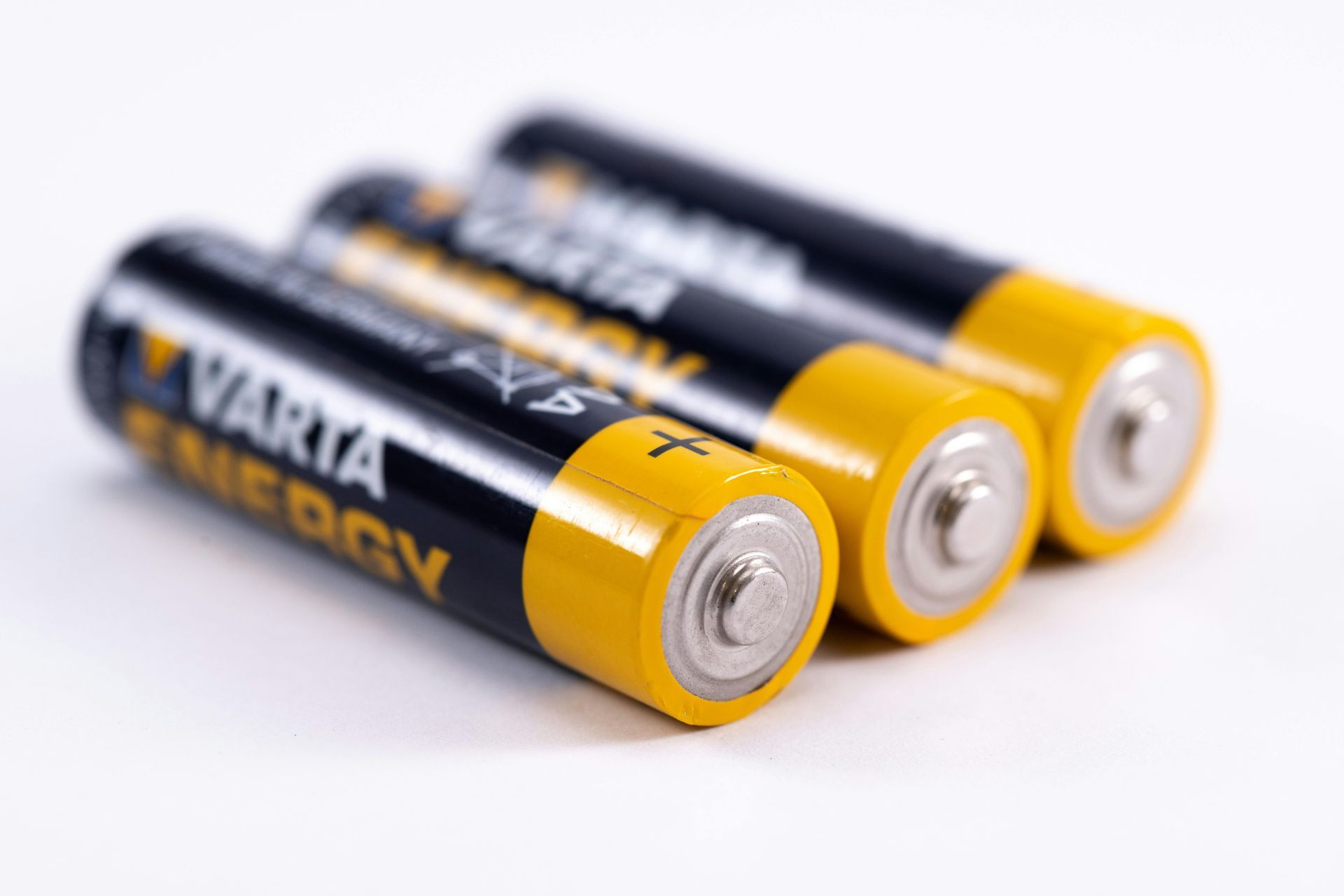 Three varta batteries are stacked on top of each other