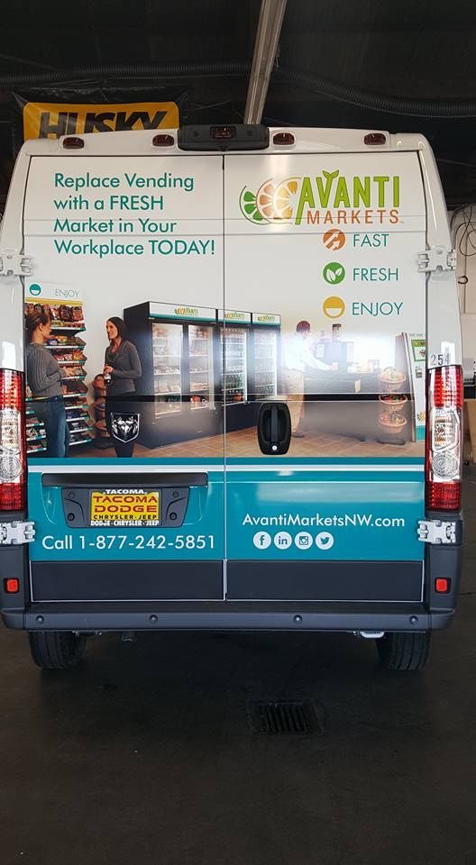 Rear view of an Avanti Markets van featuring branding, contact information, and an image of a workplace micro-market.