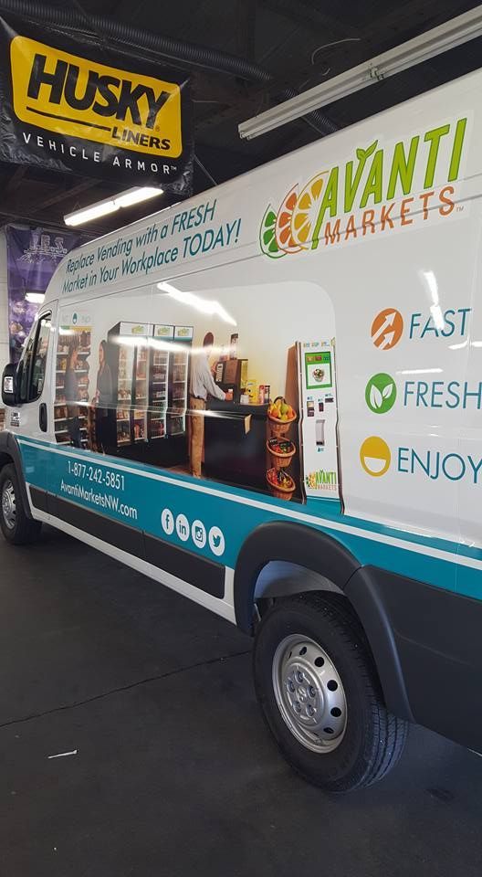 Food truck under a Husky sign, with coffee service window and “Fast, Fresh, Enjoy” branding.