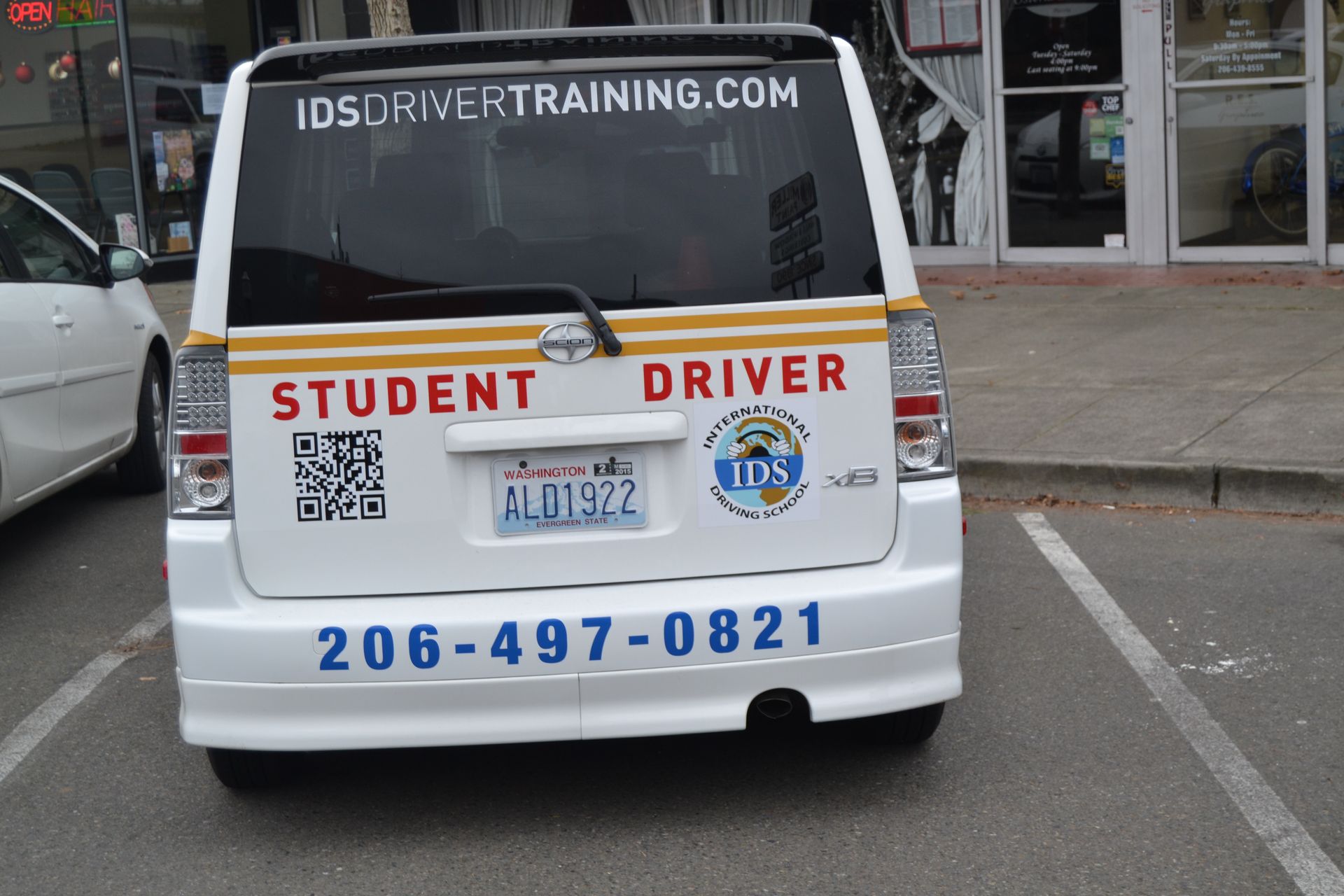 White Scion driver training car marked with 