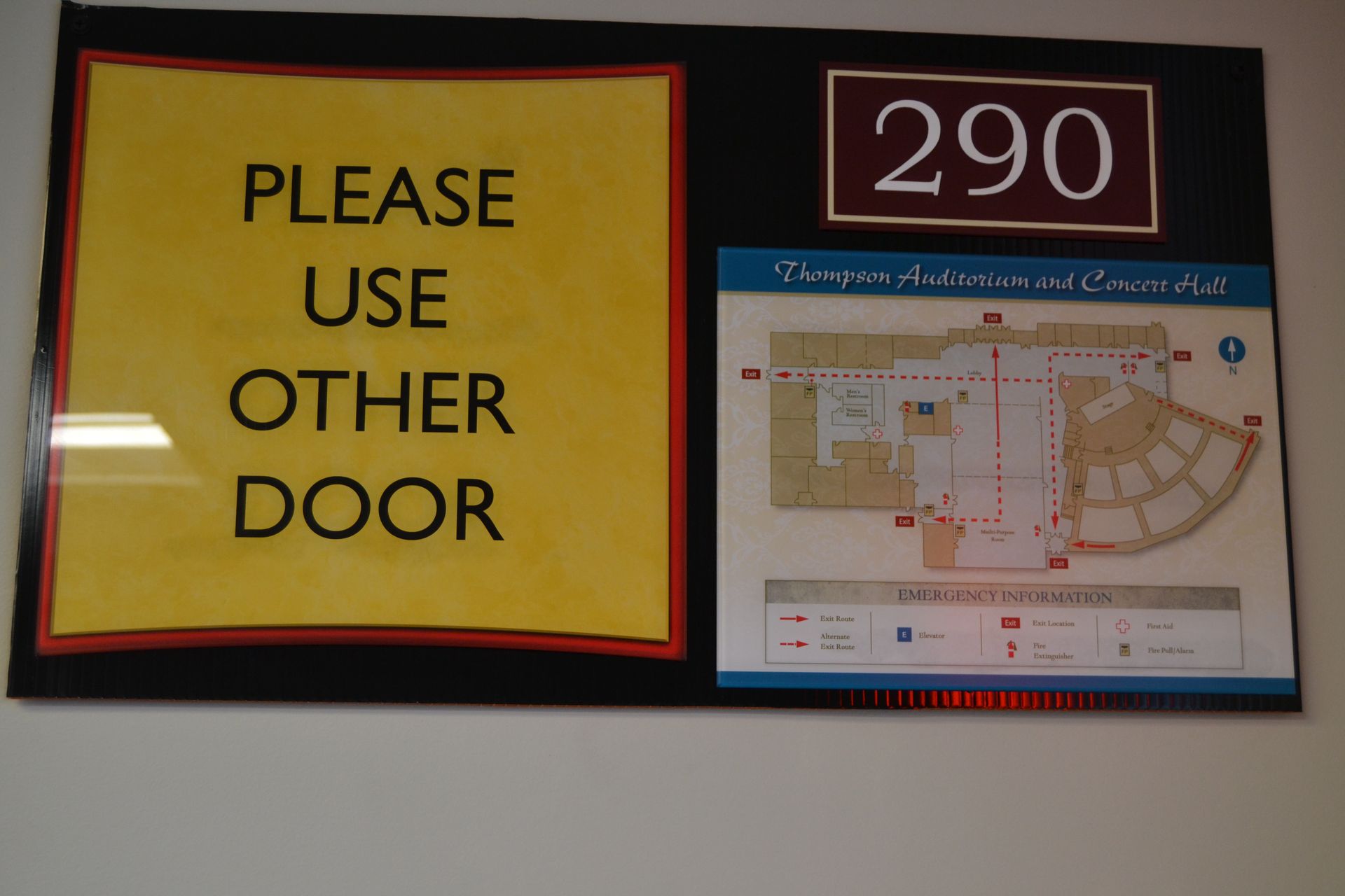 A wall sign labeled 290, featuring a yellow 