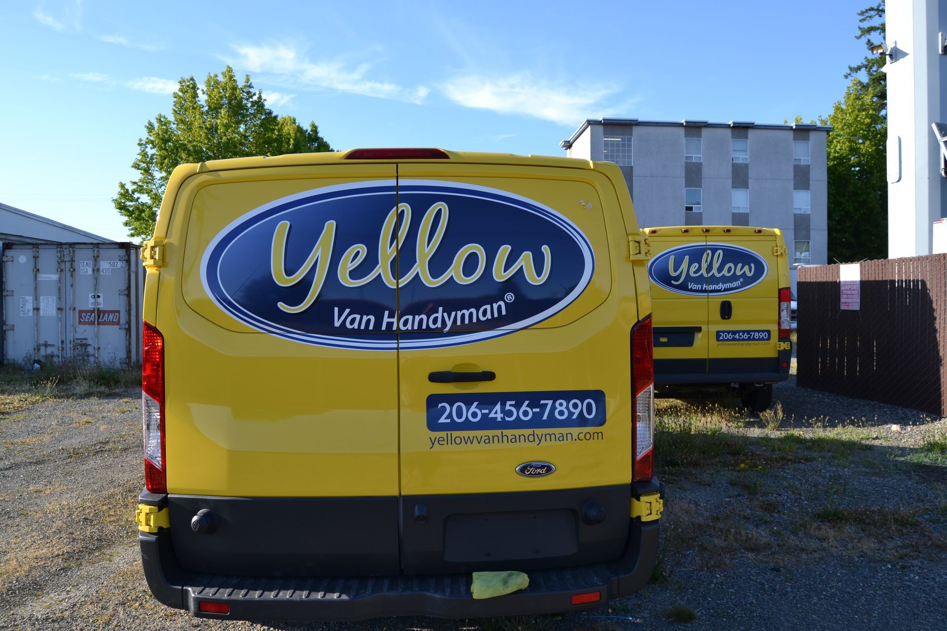 Two yellow vans branded with 