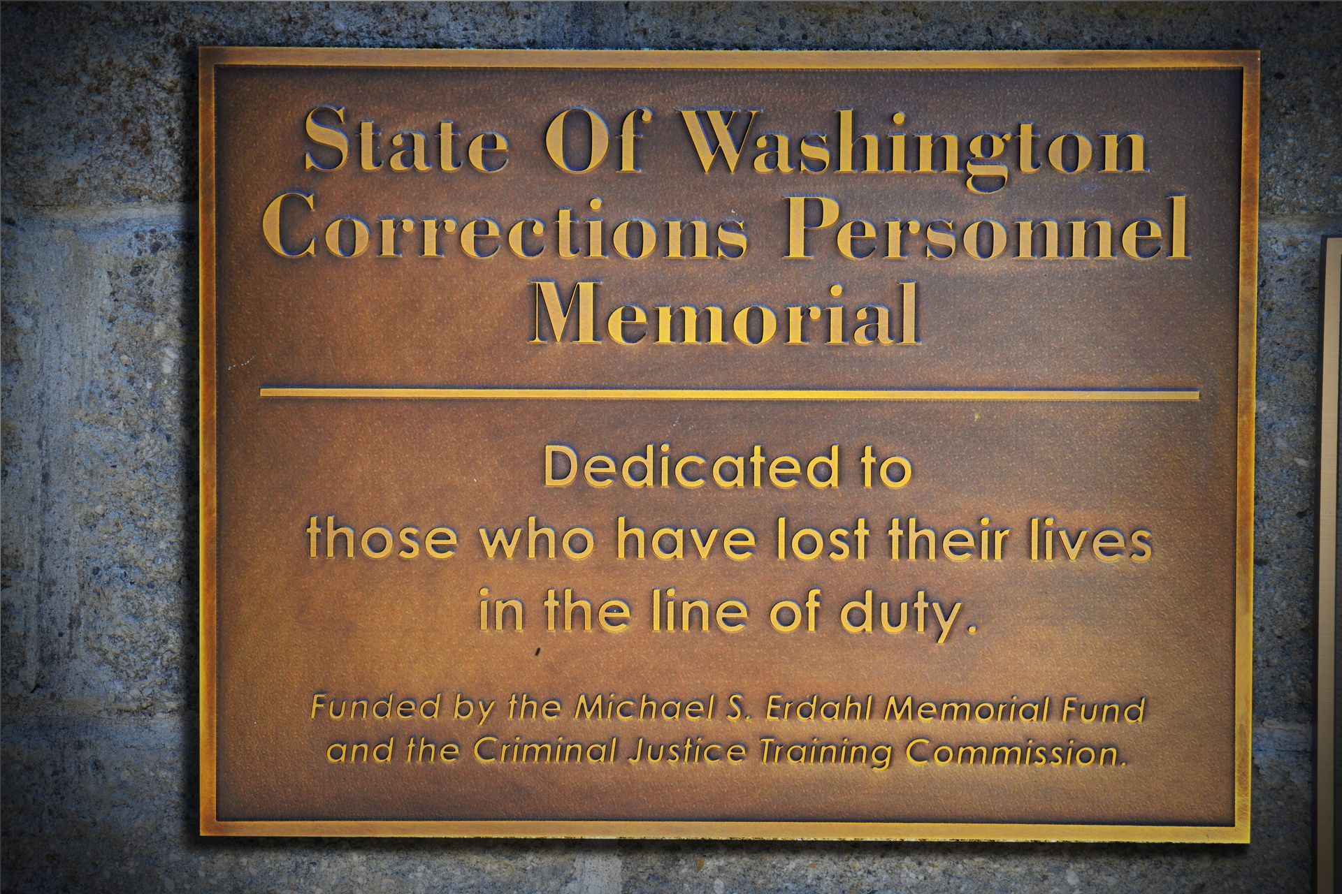 A bronze plaque titled 
