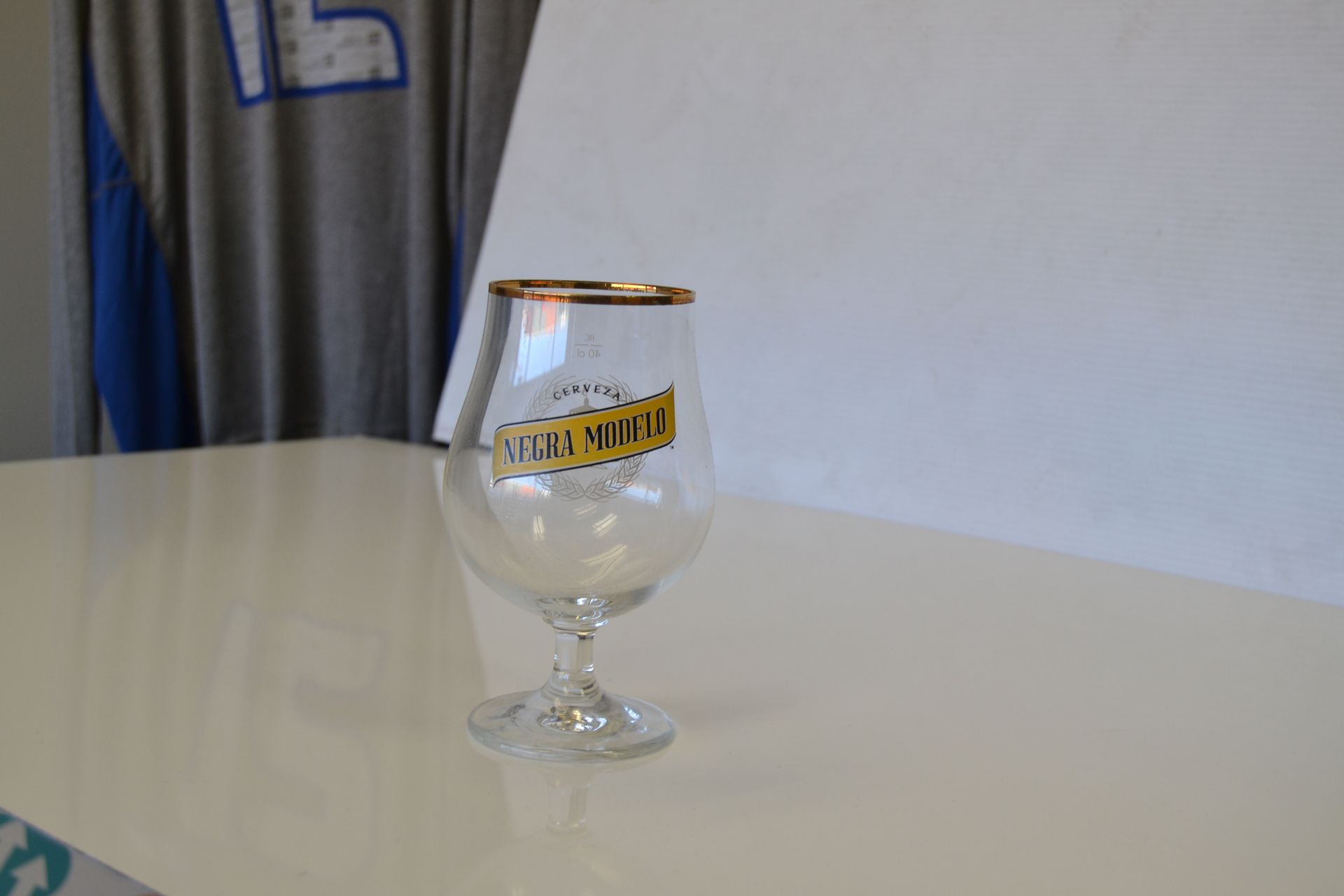 A glass with a gold rim and 