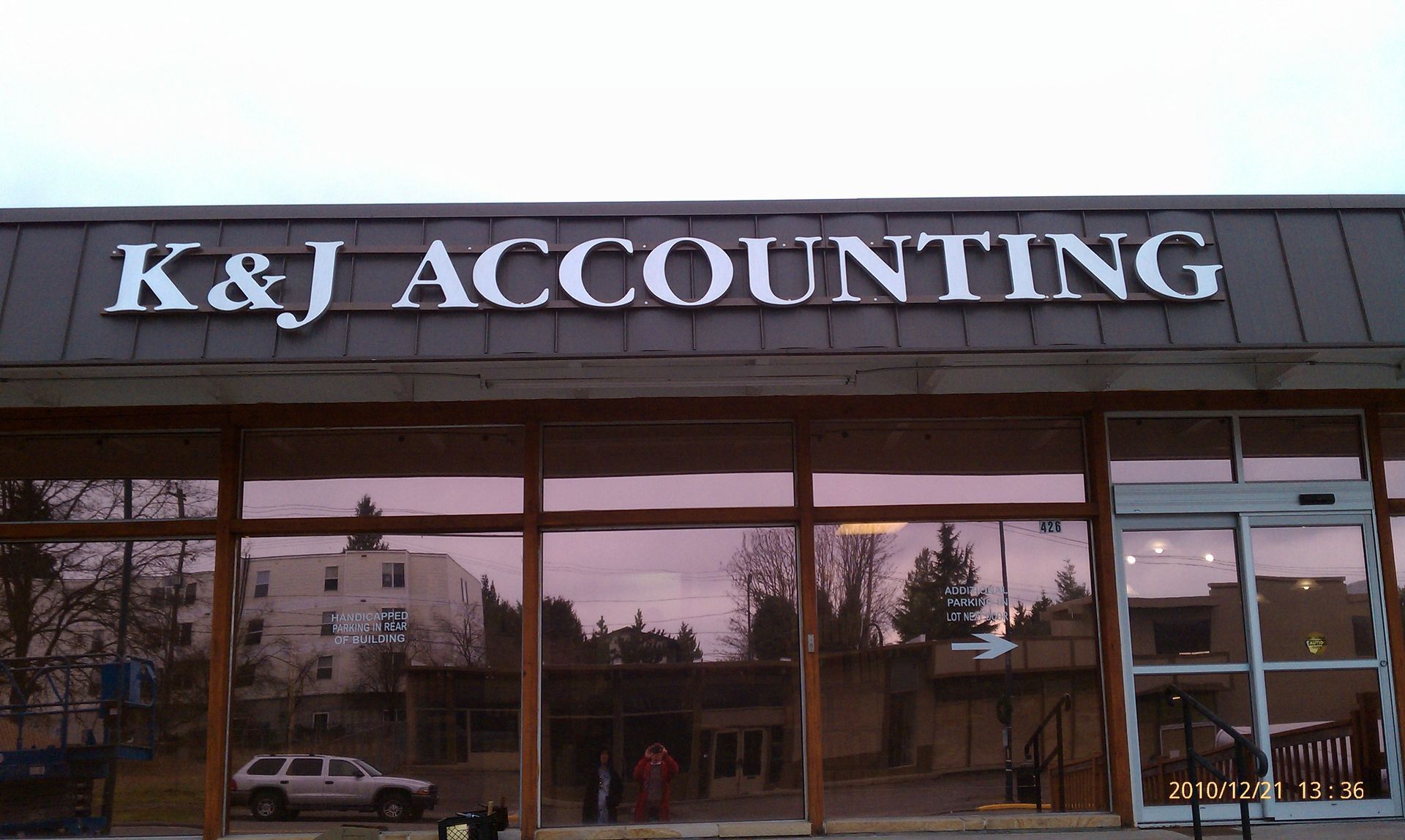 A storefront sign reads