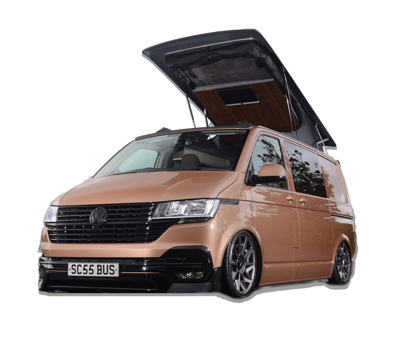 Bronze Volkswagen van with pop-up roof raised on a white background