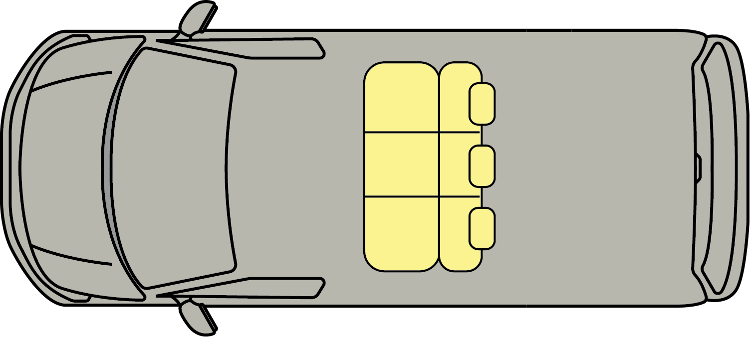 Top-down view of a gray car with yellow luggage secured on the roof rack.