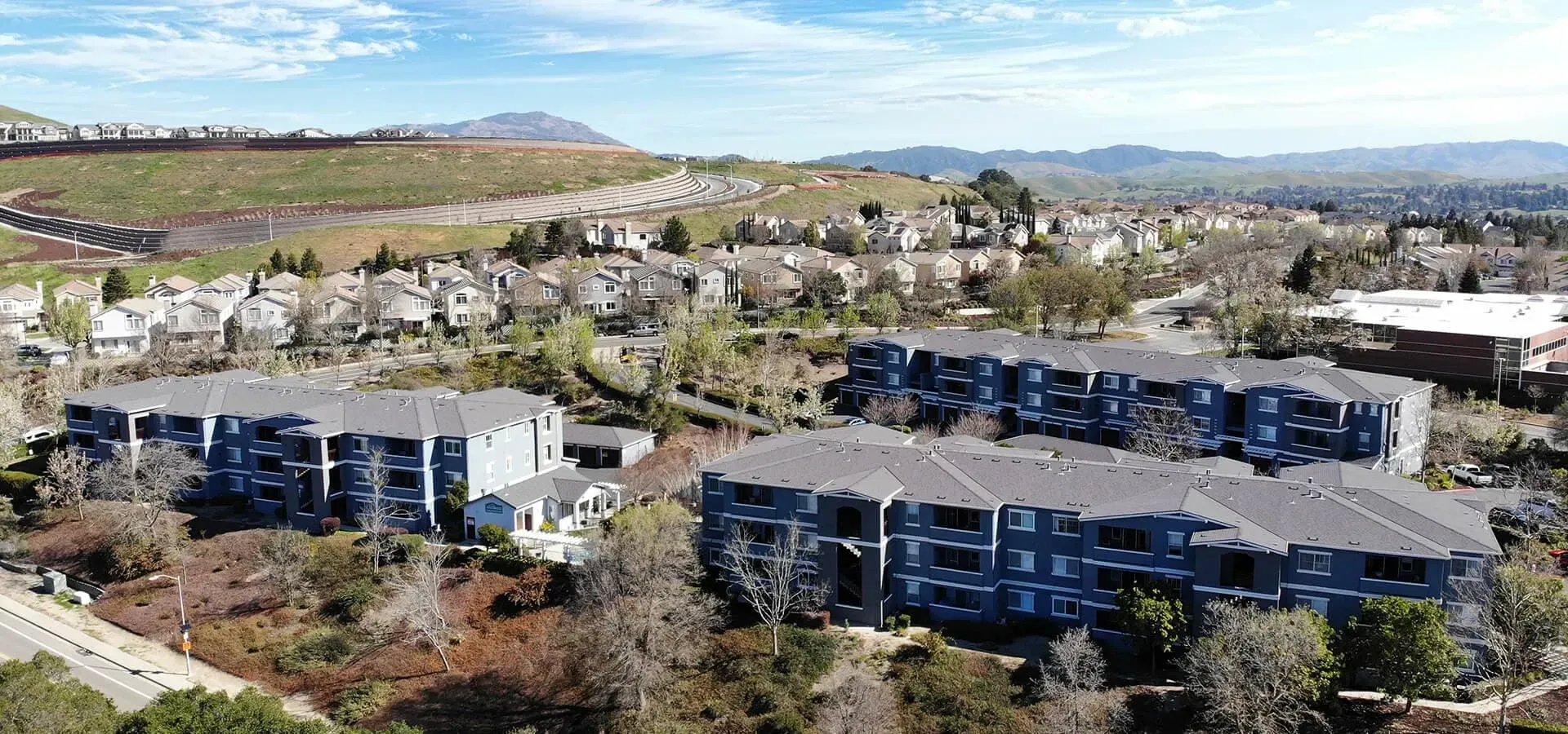 Aerial view of apartment buildings and surrounding neighborhood at Bollinger Crest in San Ramon, CA.