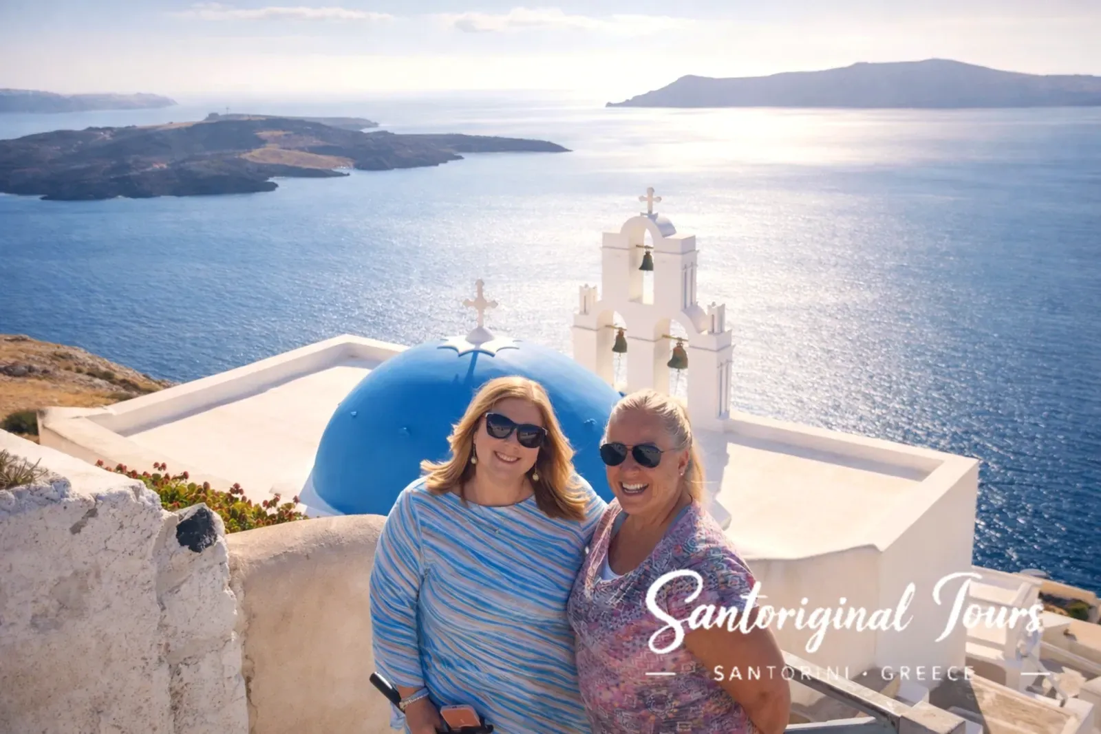 Guests visiting the blue domes during the Santorini Must-See Highlights Private Tour by Santoriginal Tours