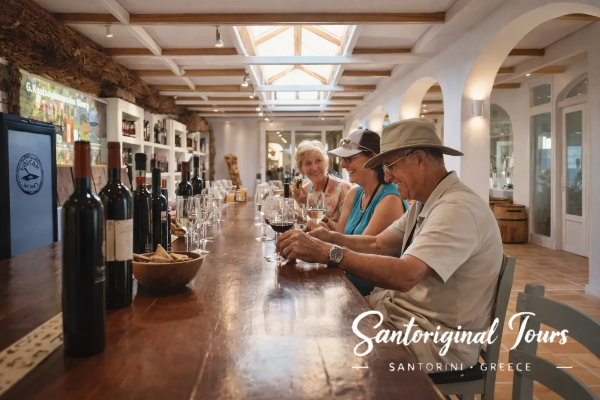 Friends enjoying a wine tasting in Santorini during a private tour