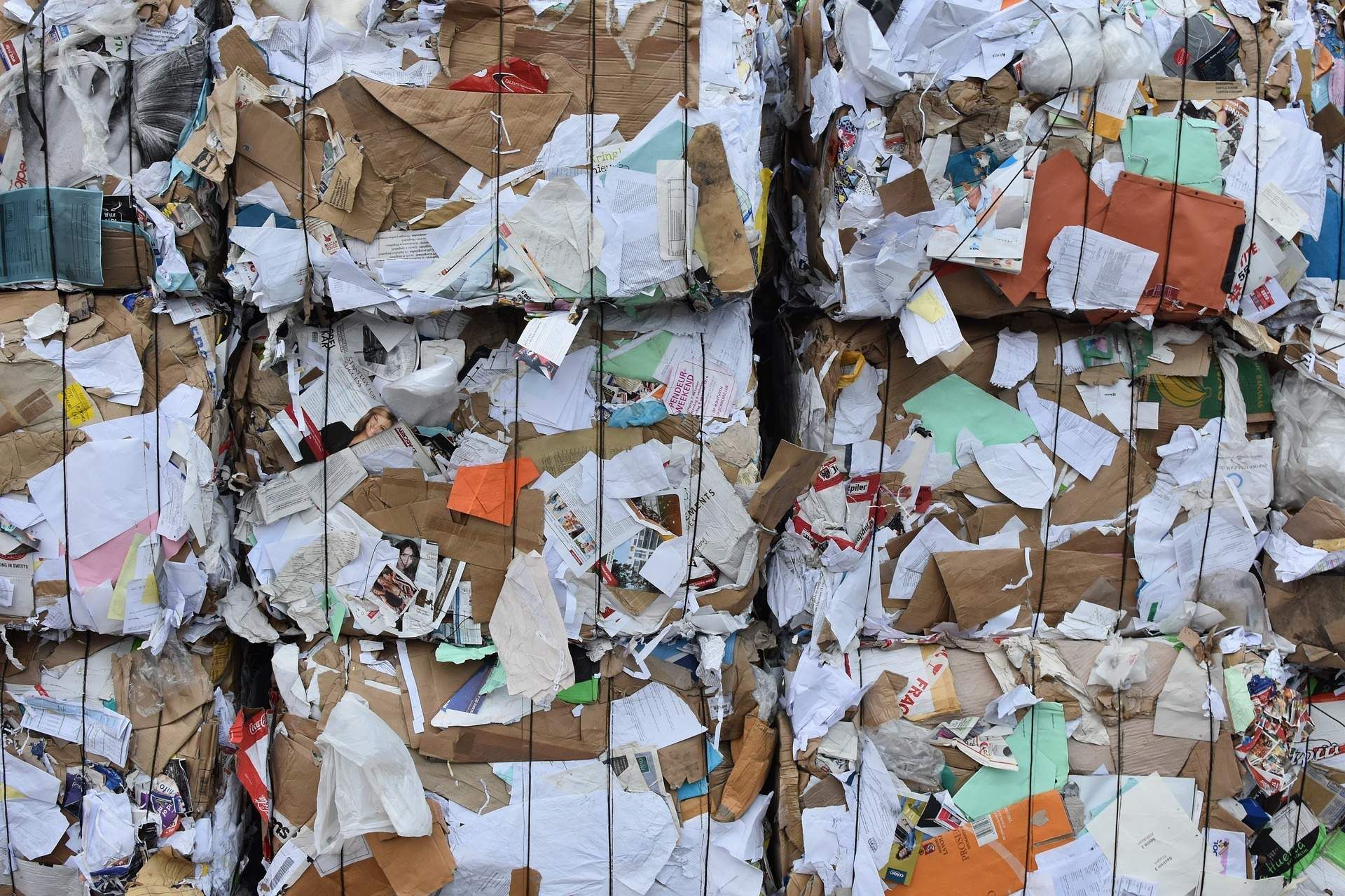 A pile of cardboard and paper stacked on top of each other.