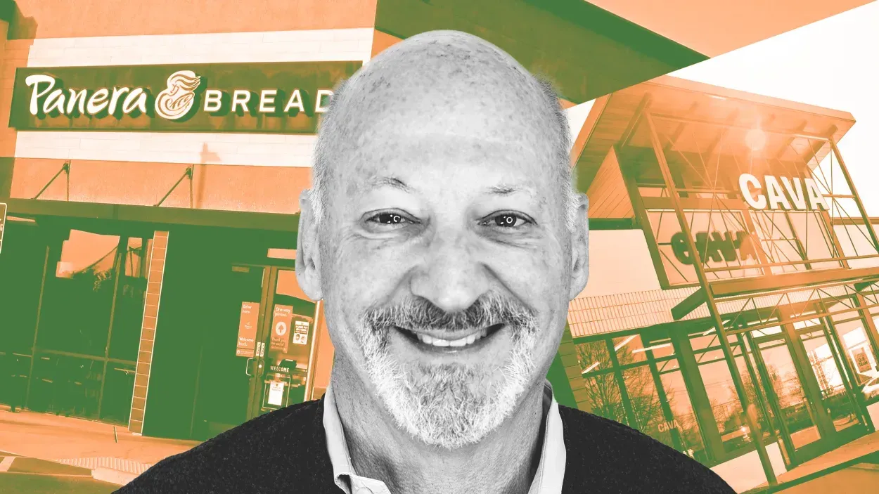 Ron Shaich is smiling in front of a panera bread store