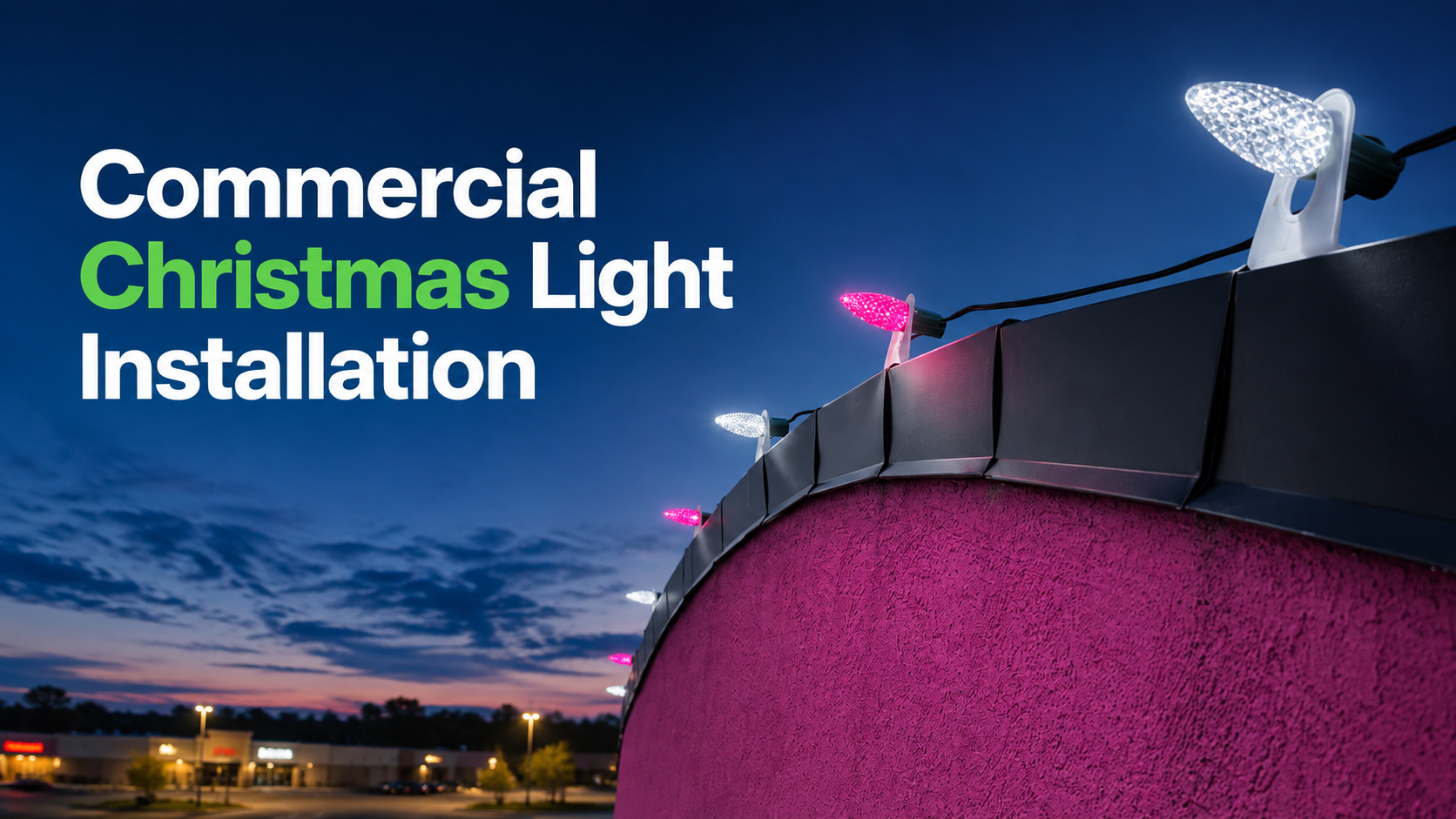 Commercial Christmas light installation on a rooftop at dusk, with white and pink lights glowing.
