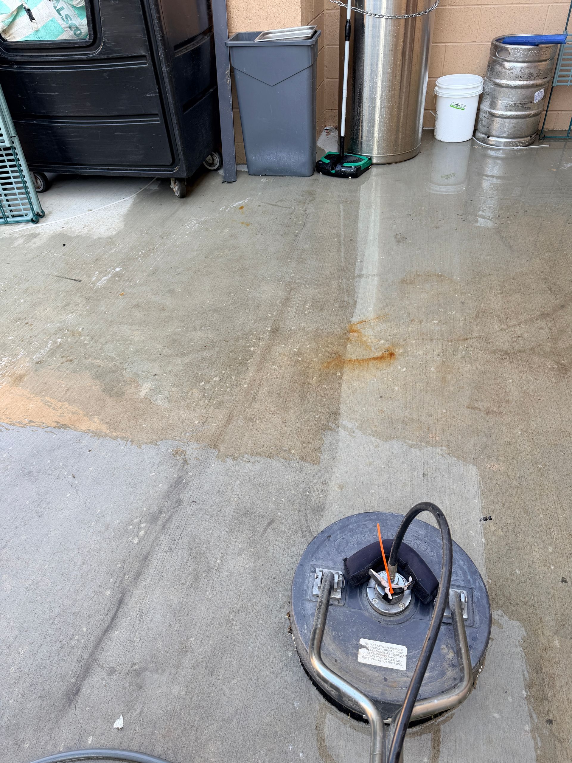 Green Pro Services power washing the dumpster pad at LongHorn Steakhouse in Bourbonnais, Illinois