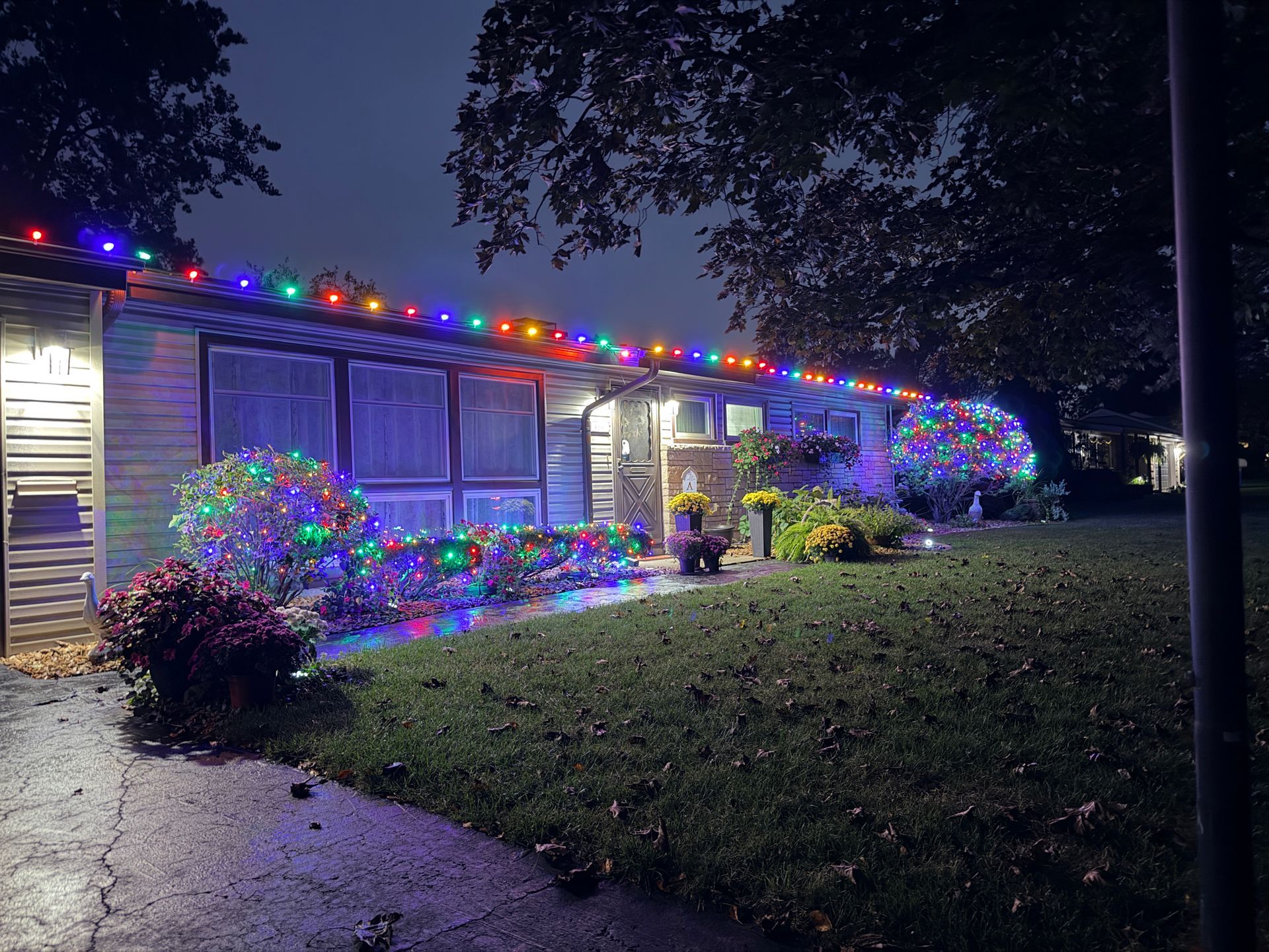 Multicolor Christmas light installation on a home in Kankakee, Illinois