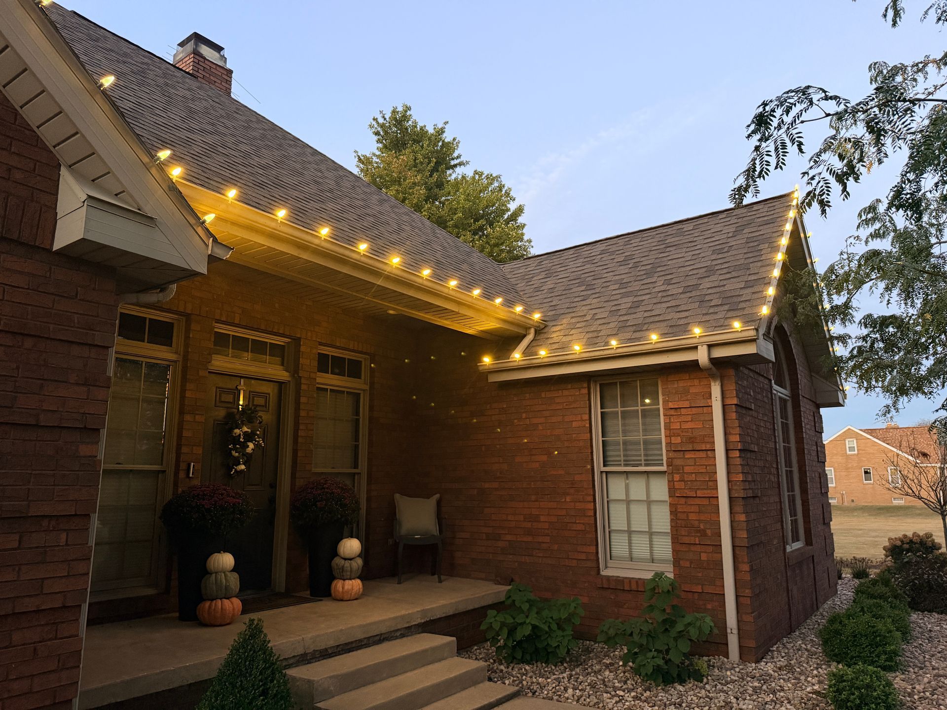 Professional Christmas light installation in St. Anne IL with warm white LED roofline lights