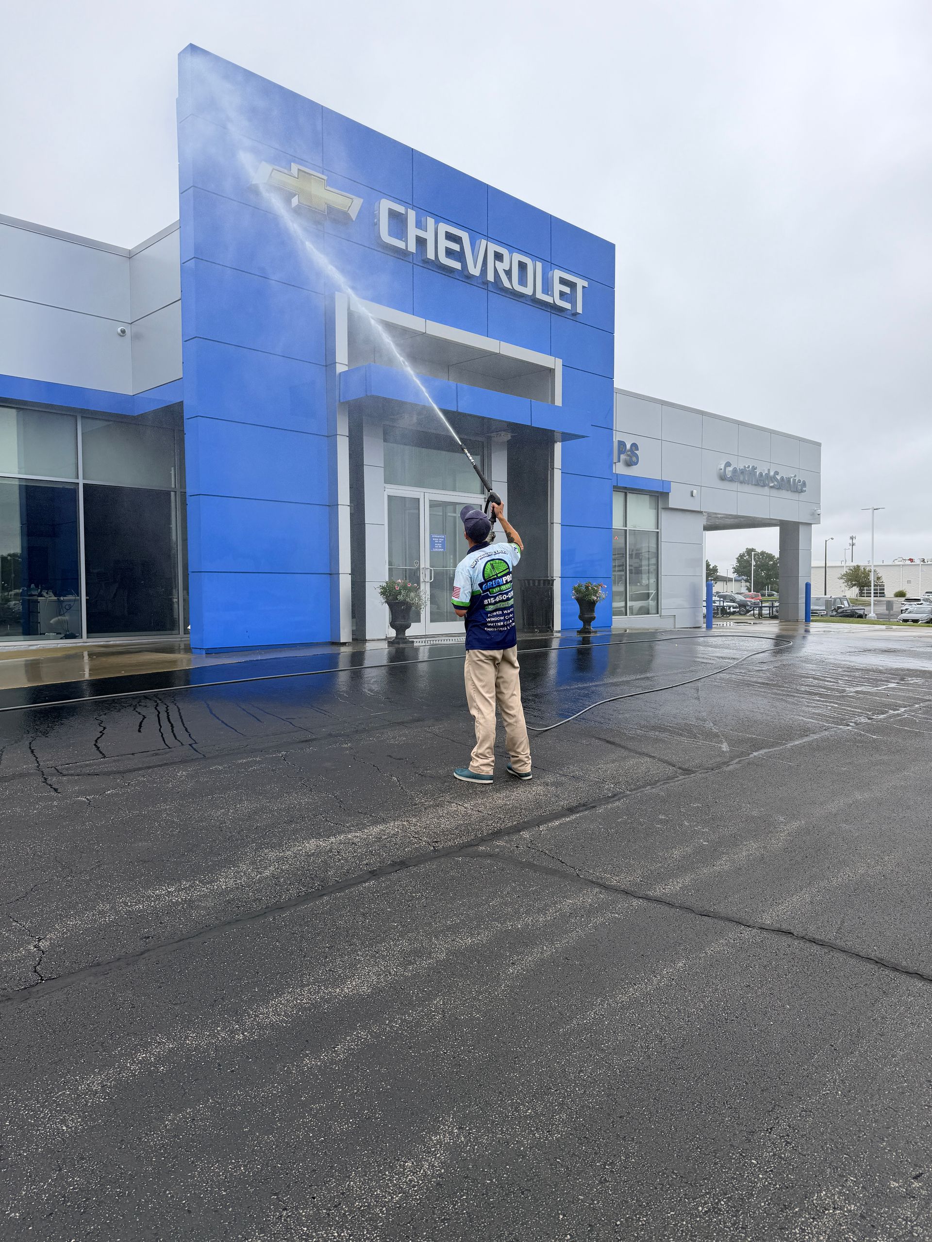 Green Pro Services soft washing the building at Phillips Chevrolet in Bradley, Illinois