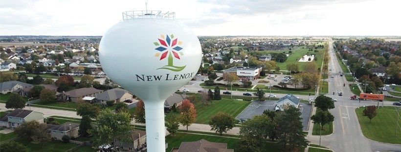 Aerial view of New Lenox water tower above a suburban neighborhood and road