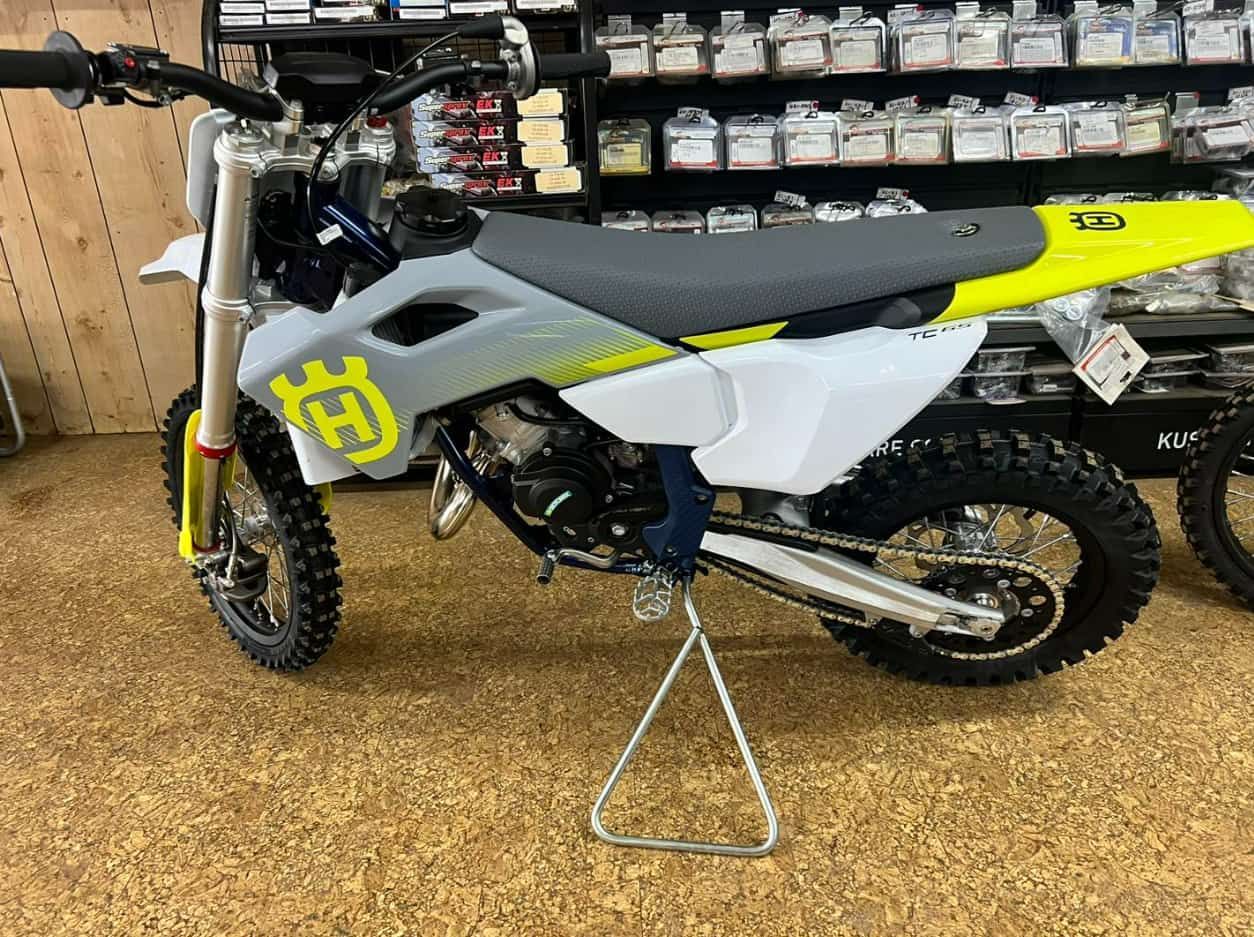 A Husqvarna Dirt Bike Is Sitting On A Stand In A Showroom — Extreme Motorcycles In Atherton, QLD