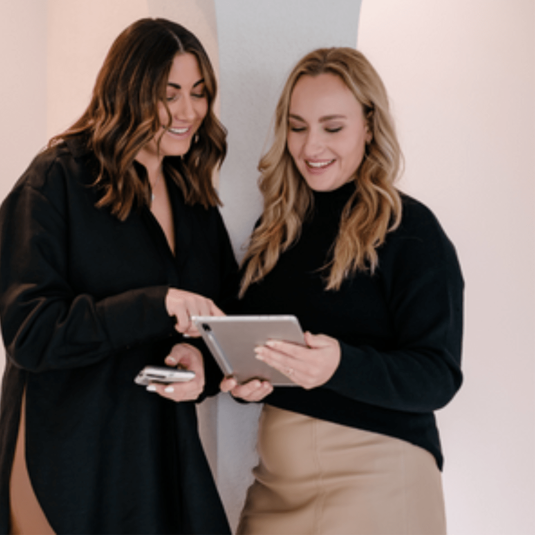 Two of Soqual's marketing specialists working on some copywriting for a client's website.