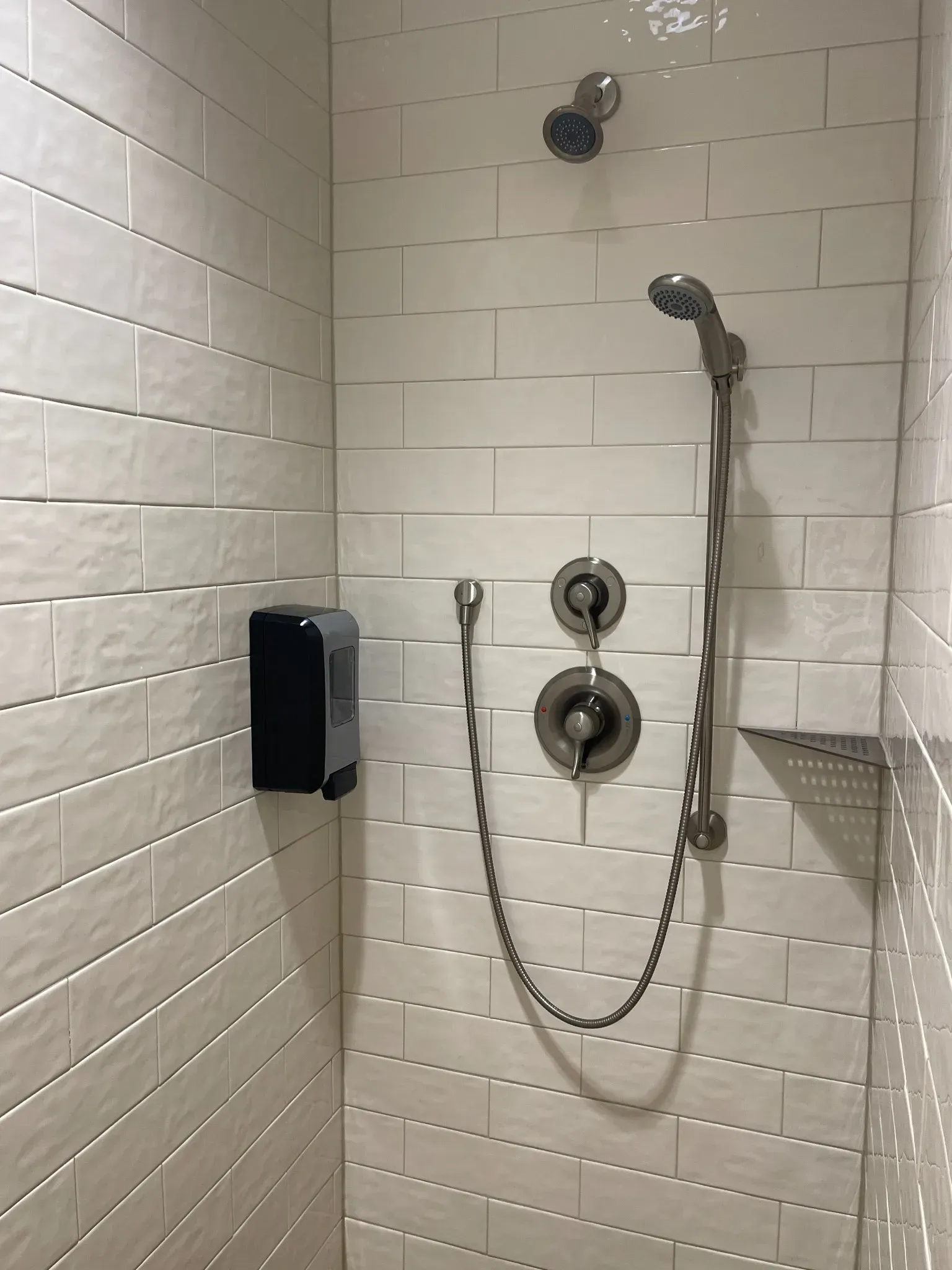 Private driver shower room with restroom and fresh towels at TA Janesville