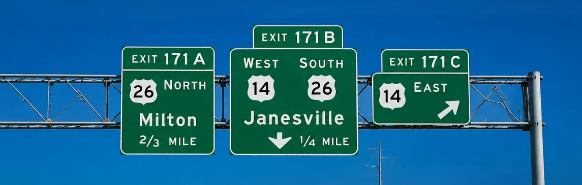 Highway signs for Exit 171B Route 26 Janesville to the TA Janesville Travel Center/Mobil Truck Stop